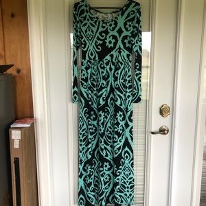 Beautiful teal with black design maxi dress with long sleeves.